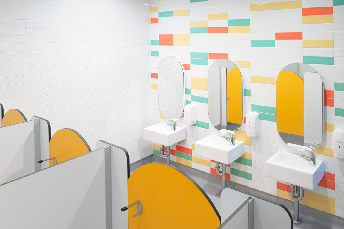 Modern school bathroom at Meriden School with colourful feature tiles